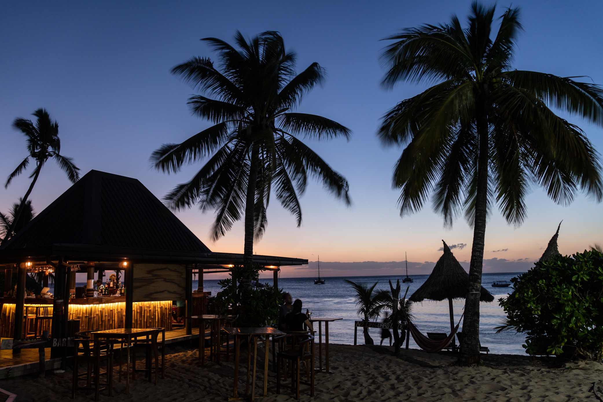 Twilight over a beach bar in the Waya island, part of the Yasawa group, in Fiji