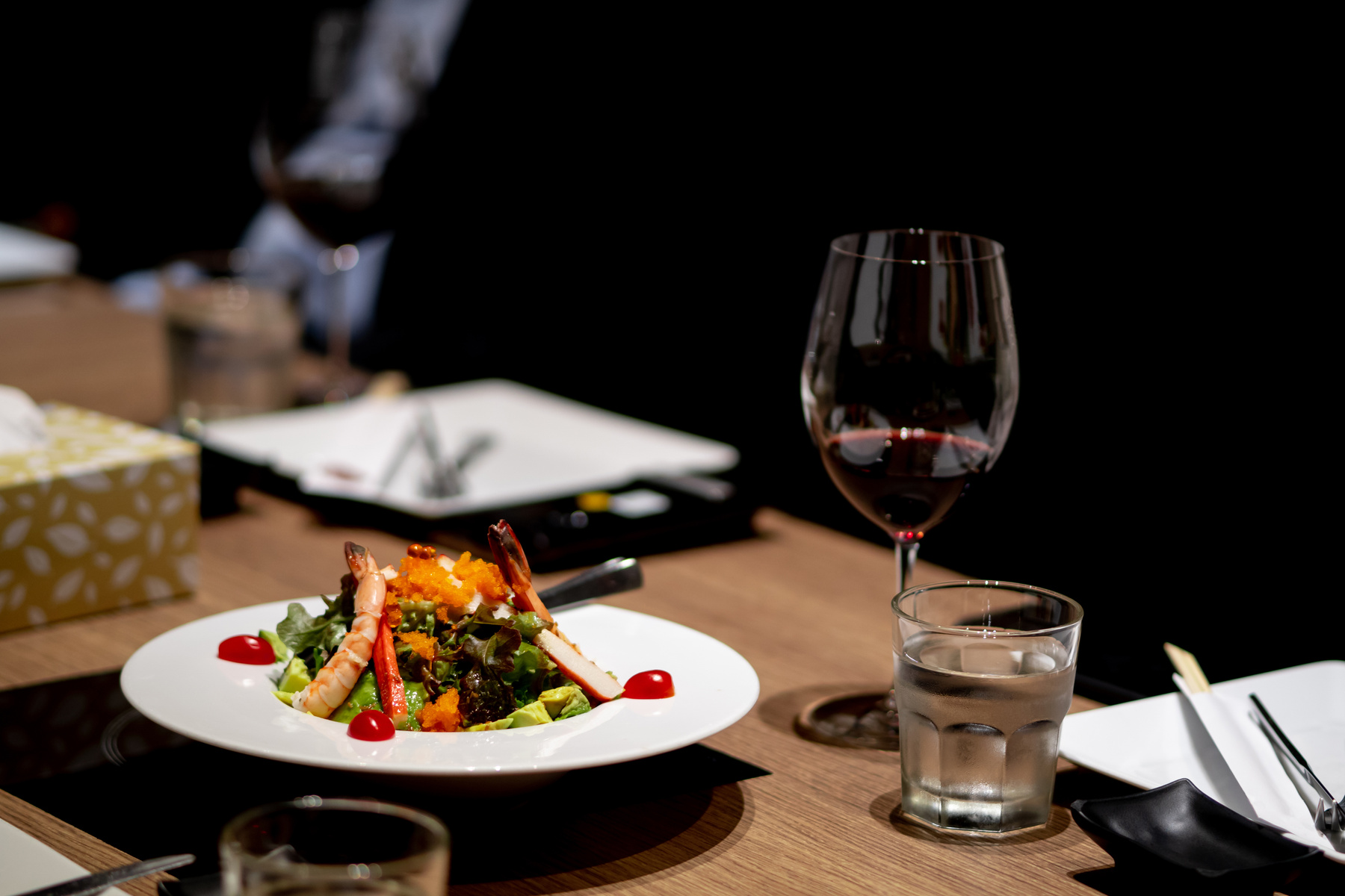 Dinner is placed on the dining table in a fine dining restaurant